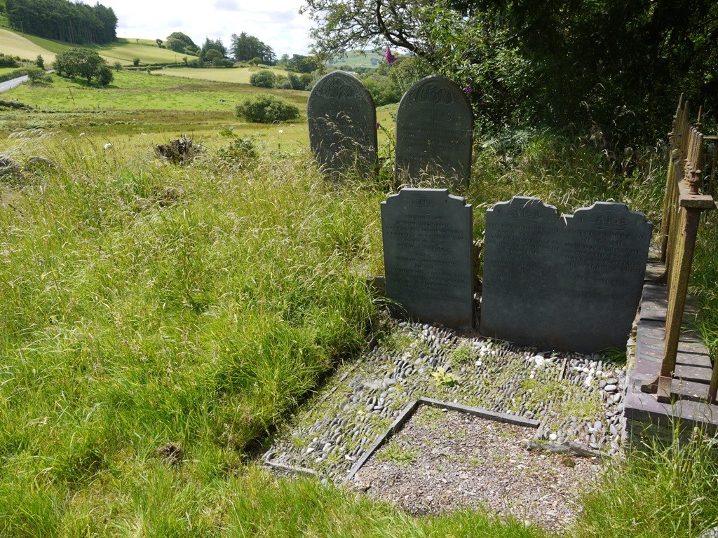 Cobbling on the grave distinguish the adult grave from the infants to the right