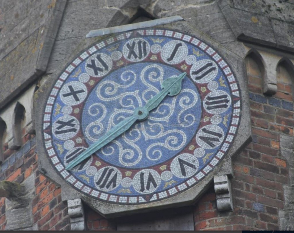 Clock face mosaic by Jesse Rust, at Ayot St Peter